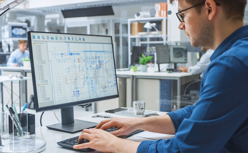 Engineer designing product using CAD