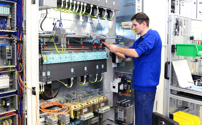 Engineer Retrofitting Industrial IoT PLC Module